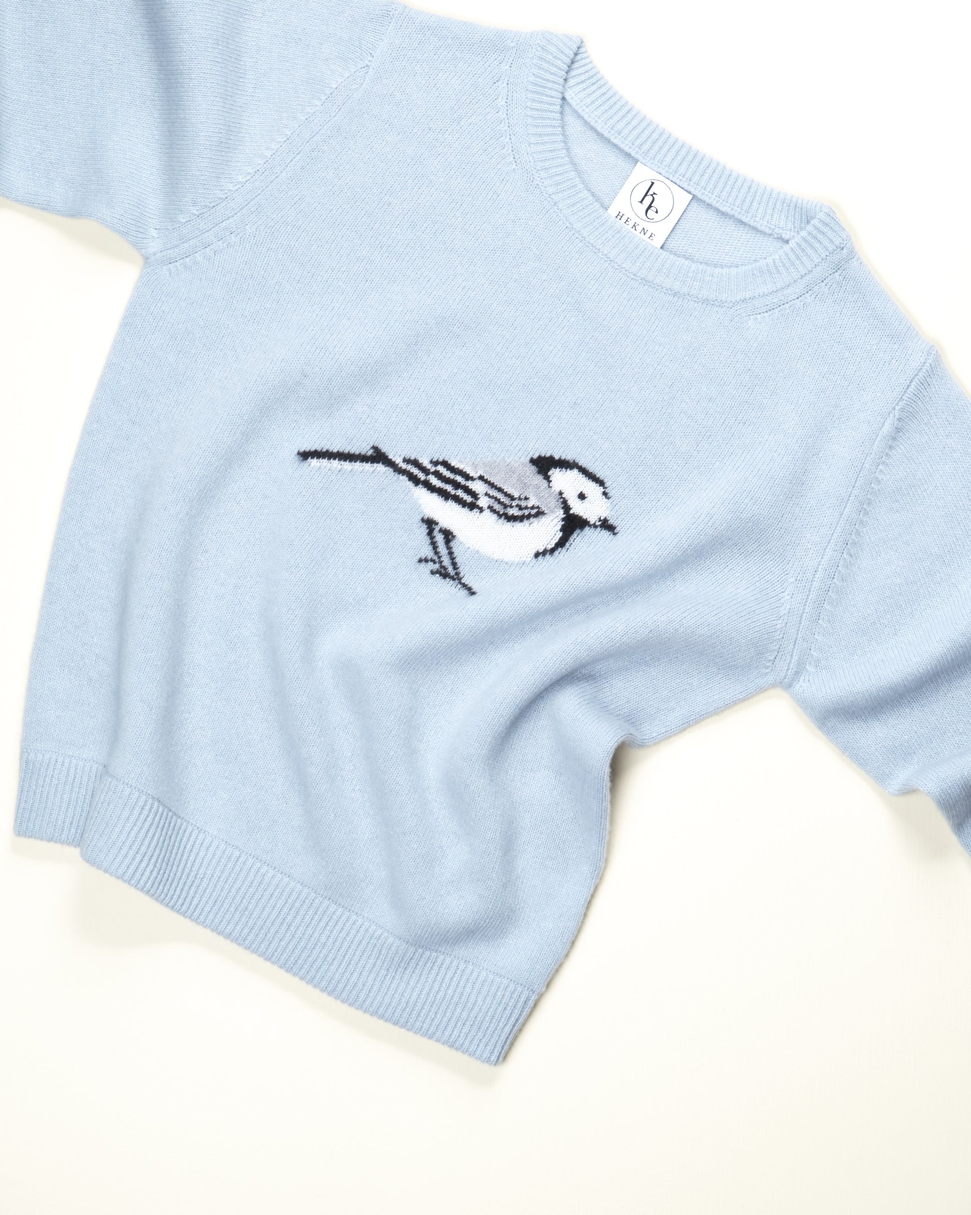 Genser i lett ull med linerle.